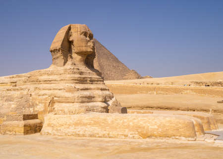 Great Sphinx of Giza, with the Great Pyramid in the backgroundのeditorial素材