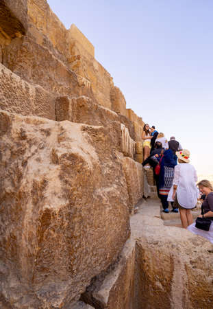 Tourists climbing  Pyramid of Giza near Cairo. Captured in Egypt. Autumn 2018のeditorial素材