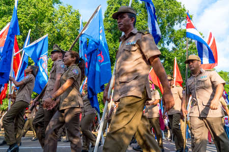 People marching with flags during May day parade or International Workers' Day, Havana, Cuba, spring 2018のeditorial素材