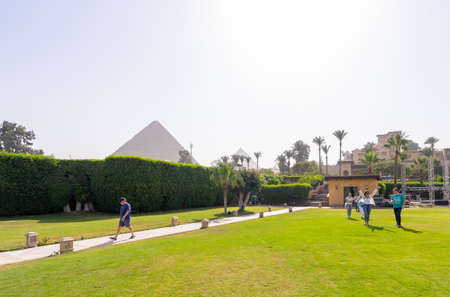 meadow and park with Cheops pyramid in the background. Pyramids of Giza near Cairo, Egypt. Autumn 2018のeditorial素材