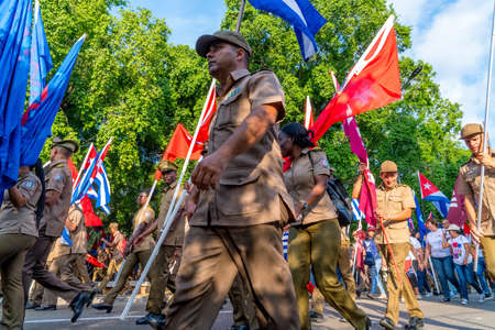 People marching with flags during May day parade or International Workers' Day, Havana, Cuba, spring 2018のeditorial素材