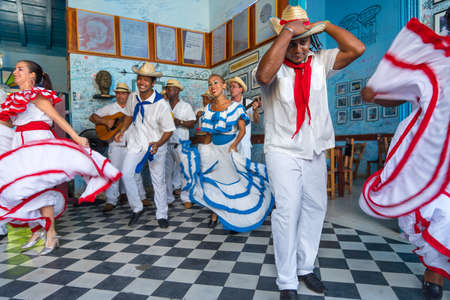 Dancers in costumes and musicians perform traditional cuban folk dance in cafe in Trinidad. Cuba, spring 2018のeditorial素材