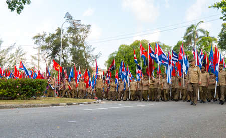 People marching with flags during May day parade or International Workers' Day, Havana, Cuba, spring 2018のeditorial素材