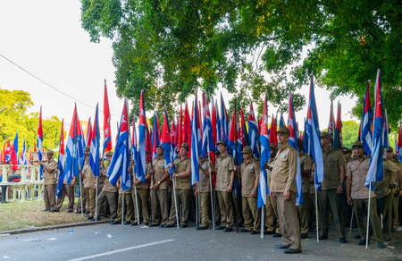 People marching with flags during May day parade or International Workers' Day, Havana, Cuba, spring 2018のeditorial素材