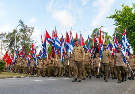People marching with flags during May day parade or International Workers' Day, Havana, Cuba, spring 2018のeditorial素材
