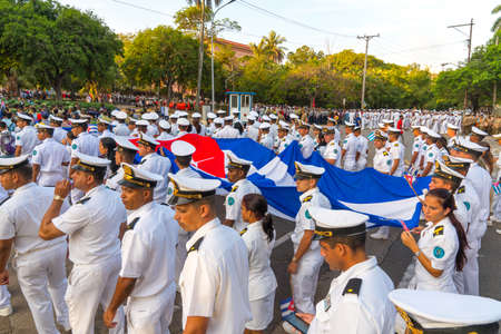 People marching with flags during May day parade or International Workers' Day, Havana, Cuba, spring 2018のeditorial素材