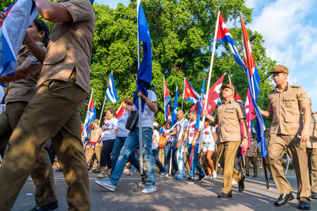 People marching with flags during May day parade or International Workers' Day, Havana, Cuba, spring 2018のeditorial素材