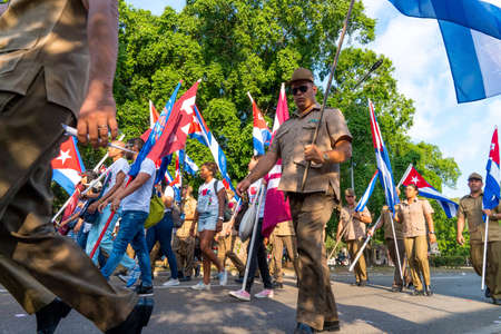People marching with flags during May day parade or International Workers' Day, Havana, Cuba, spring 2018のeditorial素材