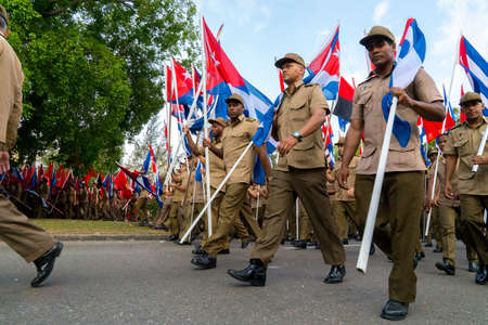 People marching with flags during May day parade or International Workers' Day, Havana, Cuba, spring 2018のeditorial素材
