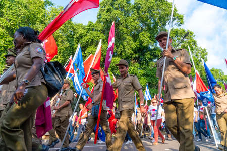 People marching with flags during May day parade or International Workers' Day, Havana, Cuba, spring 2018のeditorial素材