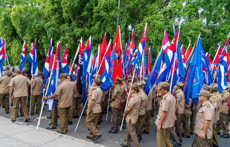 People marching with flags during May day parade or International Workers' Day, Havana, Cuba, spring 2018のeditorial素材