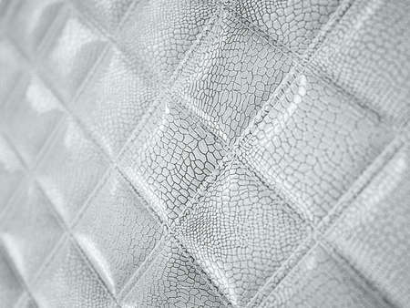 Alligator or snake Leather. Square stitched texture or background with bumps. Artistic shallow DOF 3d render, 3d illustrationの写真素材