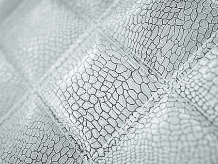 Alligator or crocodile Leather. Square stitched texture or background with bumps. Artistic shallow DOF 3d render, 3d illustrationの写真素材