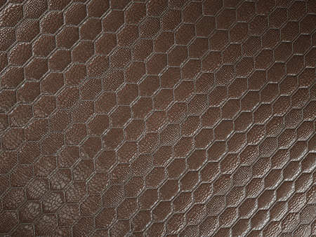 Alligator or crocodile brown Leather. hexagon or honeycomb stitched texture or background with bumps. 3d render, 3d illustrationの写真素材