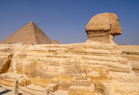 Great Sphinx of Giza, with the Great Pyramid in the backgroundの写真素材