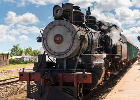Old steam locomotive or train for tourists ariive at the station. Cuba, spring 2018のeditorial素材