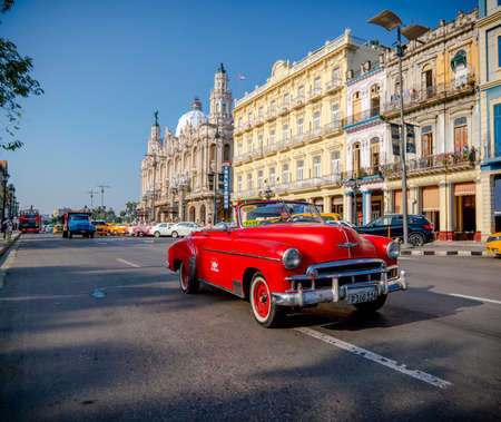 Retro car as taxi with tourists in Havana, Cuba. Captured near Gran Teatro de La Habana, El Capitolio and Paseo del Prado in spring 2019のeditorial素材