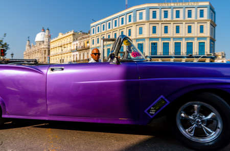 Retro car as taxi for tourists in Havana, Cuba. Captured near Gran Teatro de La Habana, El Capitolio and Paseo del Prado in spring 2019のeditorial素材