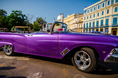 Retro car as taxi for tourists in Havana, Cuba. Captured near Gran Teatro de La Habana, El Capitolio and Paseo del Prado in spring 2019のeditorial素材