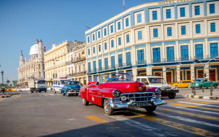Retro car as taxi with tourists in Havana, Cuba. Captured near Gran Teatro de La Habana, El Capitolio and Paseo del Prado in spring 2019のeditorial素材