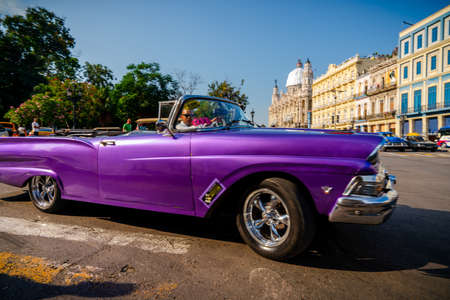 Retro car as taxi for tourists in Havana, Cuba. Captured near Gran Teatro de La Habana, El Capitolio and Paseo del Prado in spring 2019のeditorial素材