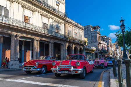 Retro car as taxi with tourists in Havana, Cuba. Captured near Paseo del Prado in spring 2019のeditorial素材