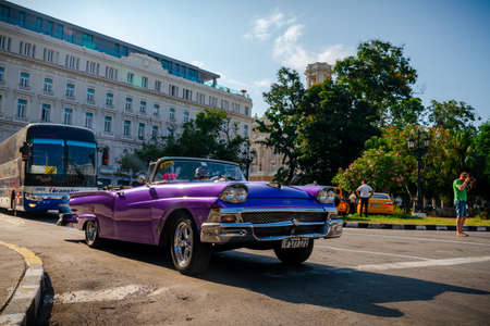 Retro car as taxi for tourists in Havana, Cuba. Captured near Gran Teatro de La Habana, El Capitolio and Paseo del Prado in spring 2019のeditorial素材