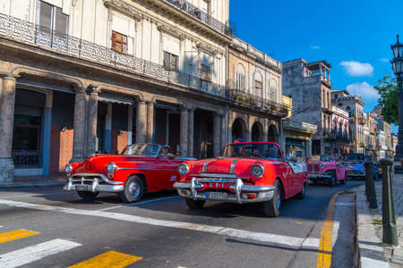 Retro car as taxi with tourists in Havana, Cuba. Captured near Paseo del Prado in spring 2019のeditorial素材