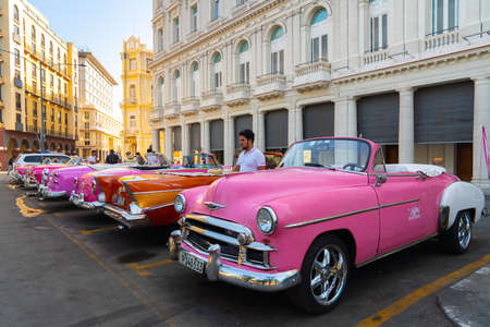 Retro car as taxi for tourists in Havana, Cuba. Captured near Gran Teatro de La Habana, El Capitolio and Paseo del Prado in spring 2019のeditorial素材