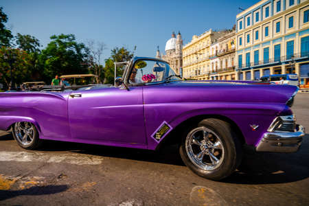 Retro car as taxi for tourists in Havana, Cuba. Captured near Gran Teatro de La Habana, El Capitolio and Paseo del Prado in spring 2019のeditorial素材