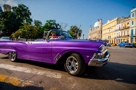 Retro car as taxi for tourists in Havana, Cuba. Captured near Gran Teatro de La Habana, El Capitolio and Paseo del Prado in spring 2019のeditorial素材