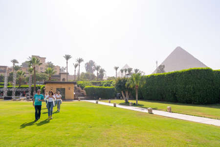 meadow and park with Cheops pyramid in the background. Pyramids of Giza near Cairo, Egypt. Autumn 2018のeditorial素材