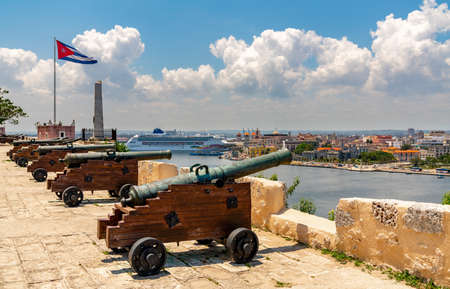Cannons at Fort of Saint Charles or Fortaleza de San Carlos de la Cabana, cuban flag and cruise ship in Havana, Cuba. spting 2019のeditorial素材