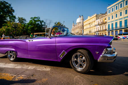 Retro car as taxi for tourists in Havana, Cuba. Captured near Gran Teatro de La Habana, El Capitolio and Paseo del Prado in spring 2019のeditorial素材