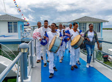 Cuban Musicians in traditional costumes perform for tourists, Santa Maria, Santa Clara, Cuba, spring 2018のeditorial素材