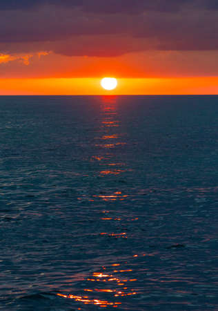 Colorful sunset or sunrise in the sea or ocean. travel photo and vacationの写真素材