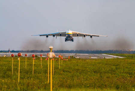 Blurred Antonov An-225 Mriya aircraft takes off from the Gostomel airport in Kyiv, Ukraine. Focus on lights This giant cargo plane is the heaviest aircraft ever built. Summer 2018のeditorial素材