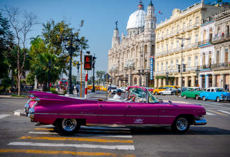 Retro car as taxi for tourists in Havana, Cuba. Captured near Gran Teatro de La Habana, El Capitolio and Paseo del Prado in spring 2019のeditorial素材