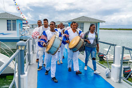 Cuban Musicians in traditional costumes perform for tourists, Santa Maria, Santa Clara, Cuba, spring 2018のeditorial素材
