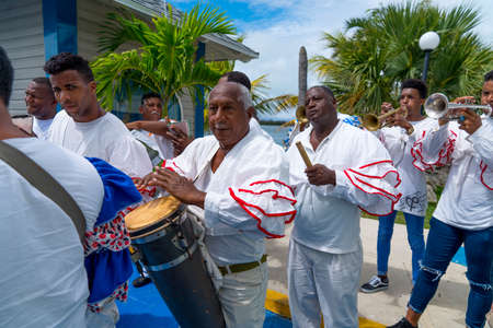 Cuban Musicians in traditional costumes perform for tourists, Santa Maria, Santa Clara, Cuba, spring 2018のeditorial素材