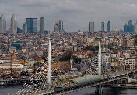 Istanbul cityscape, skyscrapers and Golden Horn Metro Bridge. March 2021のeditorial素材