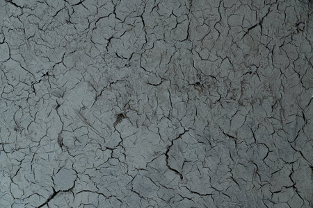 Cracked dry clay wall texture or backgroundの写真素材