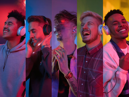 Five young men of diverse backgrounds enjoying music with headphones, smiling in vibrant, colorful lighting.の素材