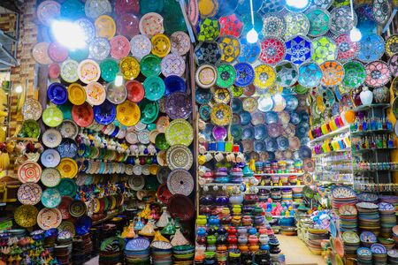 Colorful Ceramic utensils, plates and bowls on display on a roadside stalls in marakesh of moroccoの写真素材