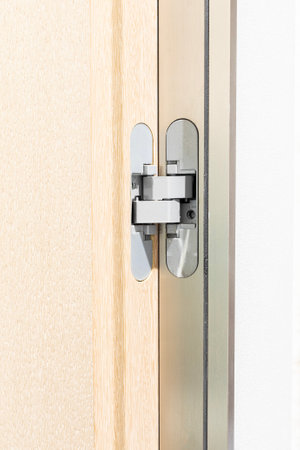 Opened door with lock, close-up. Door handle.