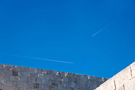 Jets flying parallel to the buildings lines and perpendicular to each other