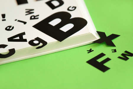 empty book with letters falling out IIの写真素材