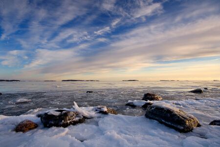 Icy sea and colorful skyの写真素材