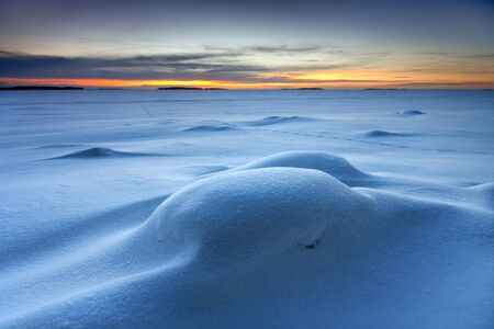 Snowy seascape in early morning dawn