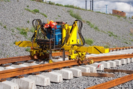 Railroad track installation machine